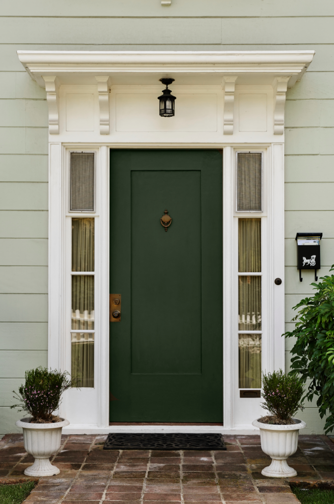 Tan House Green Door