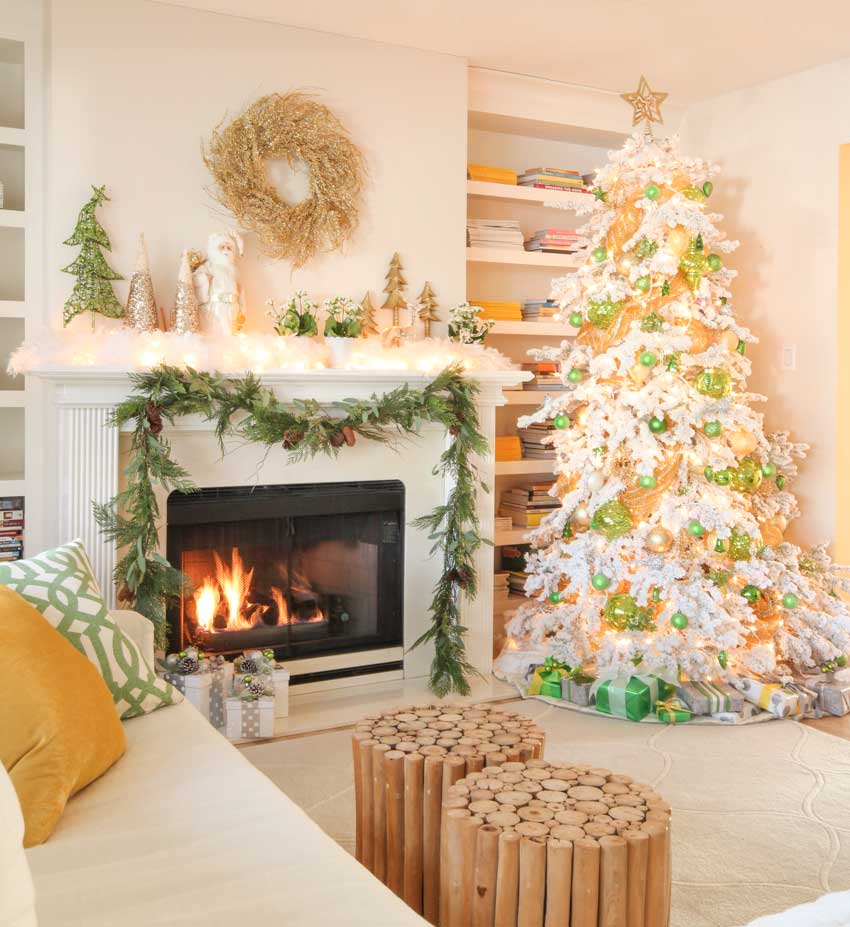 White flocked christmas tree and mantle