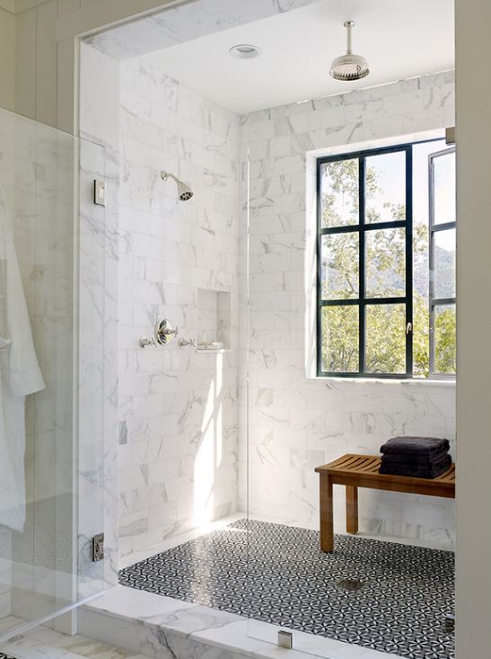 marble shower with textured tiles