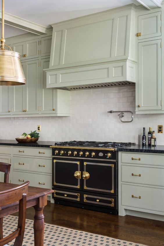 antique white kitchen cabinets with black appliances