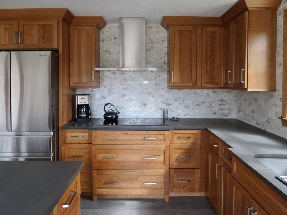 Wood cabinets with grey countertops and floors