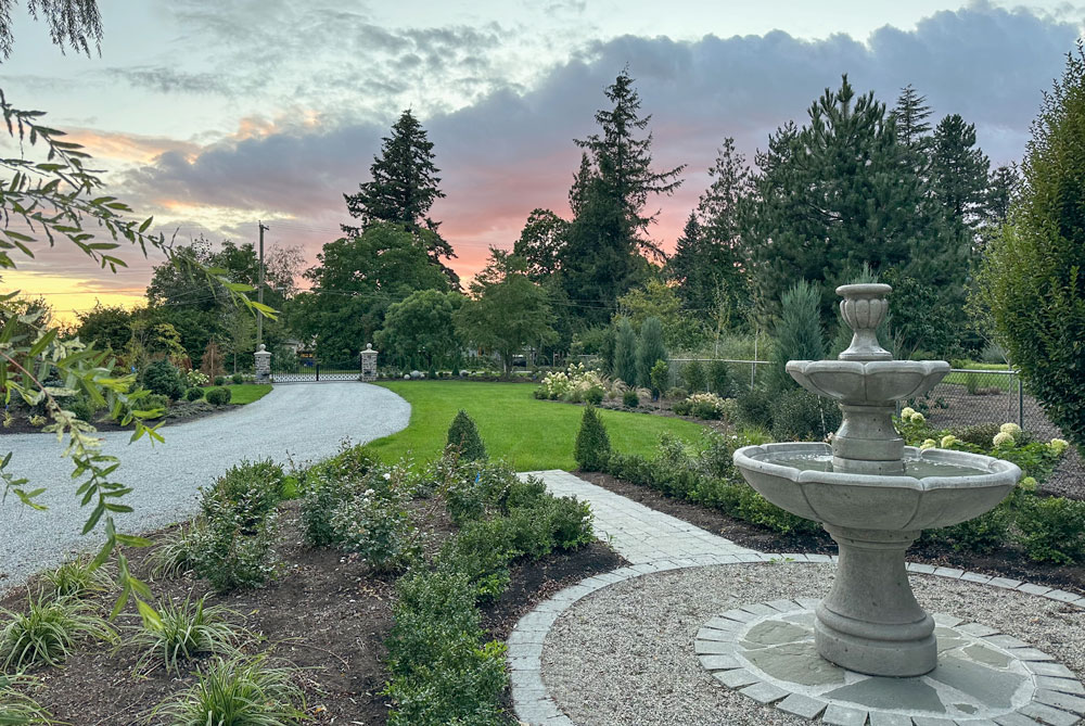 front french country landscaping installed stone fountain