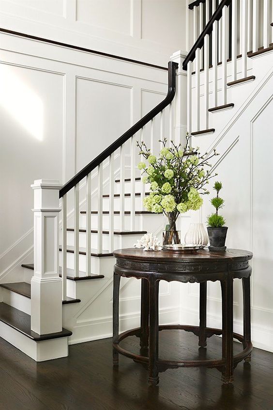 staircase with black handrail