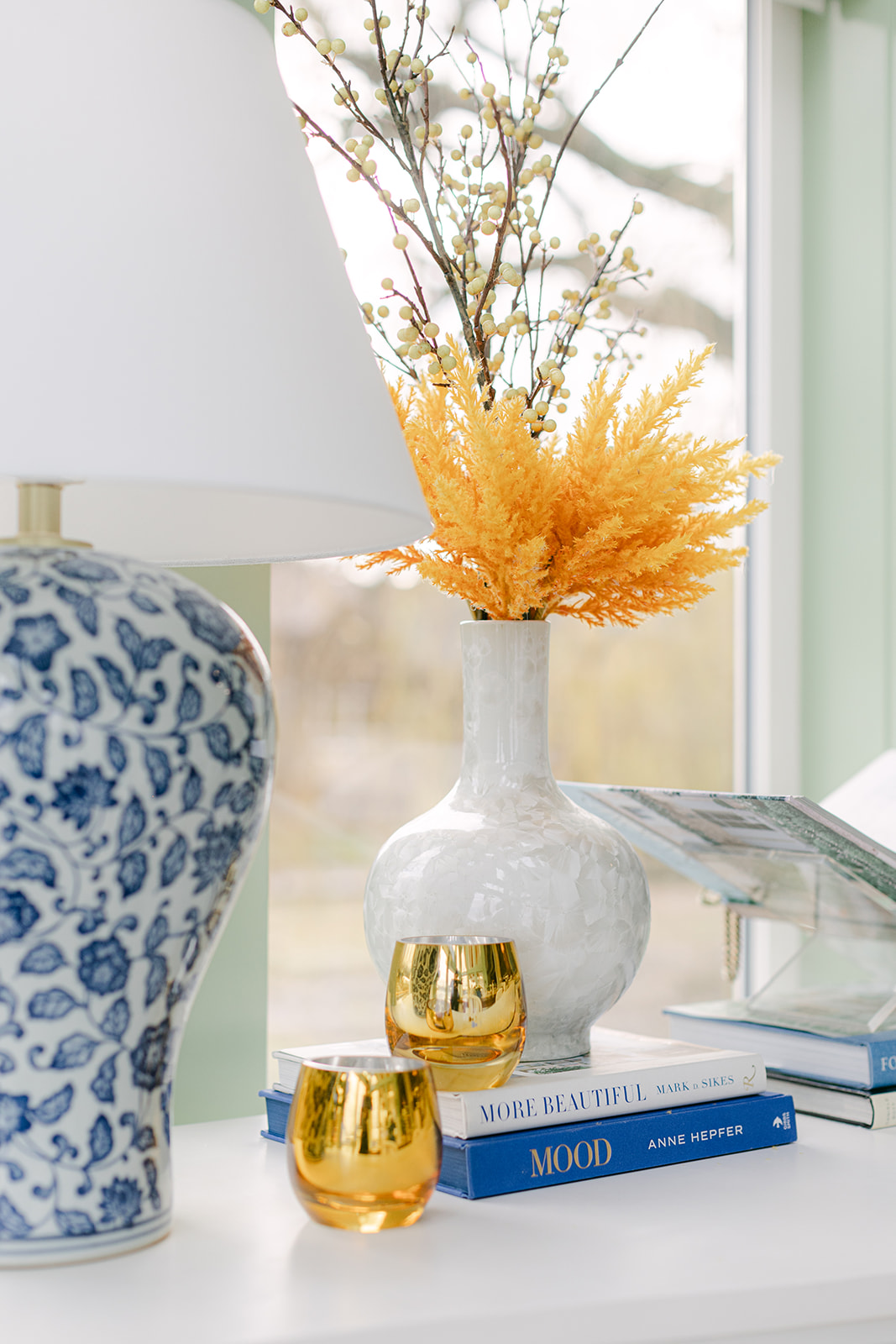 blue and white lamp styling with books