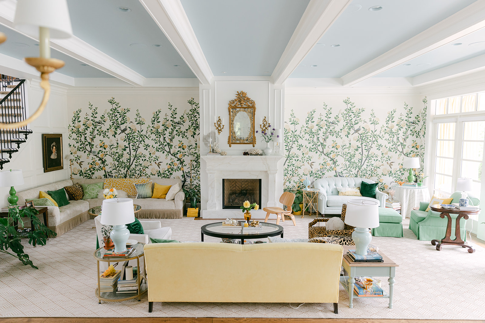 Living room yellow sofa botanical wallpaper
